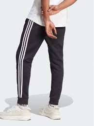 PANTALONI ESSENTIALS FRENCH TERRY TAPERED CUFF 3 STRIPES